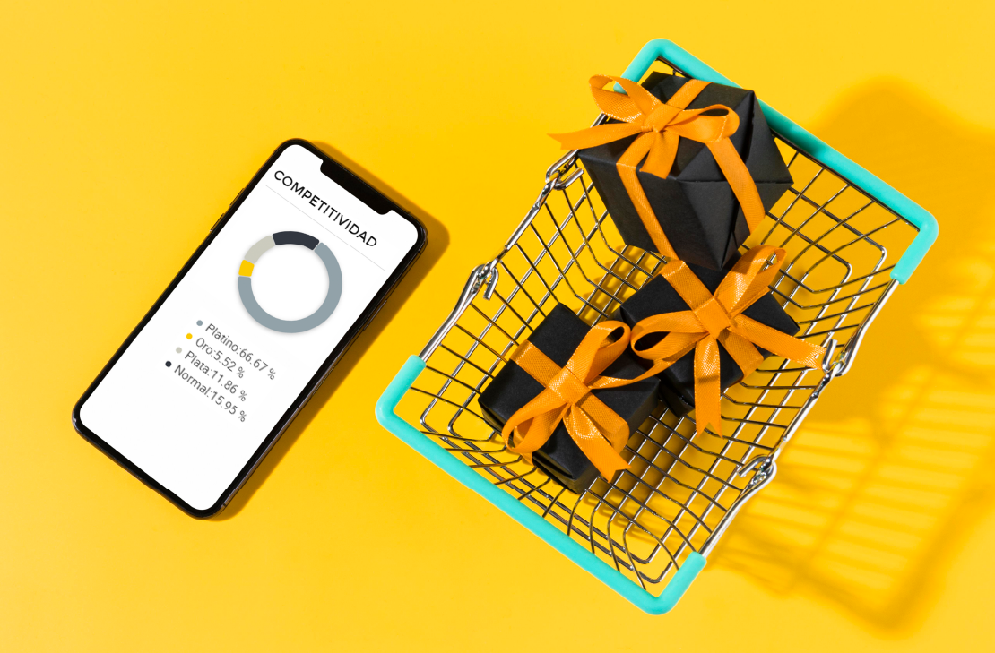 Celular mostrando gráfico de competitividad junto a carrito de compras